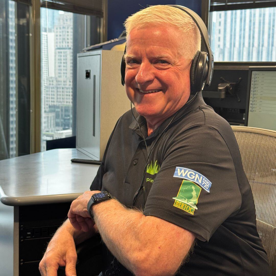 Bob Bertog smiling in headphones at the WGN Radio studio.